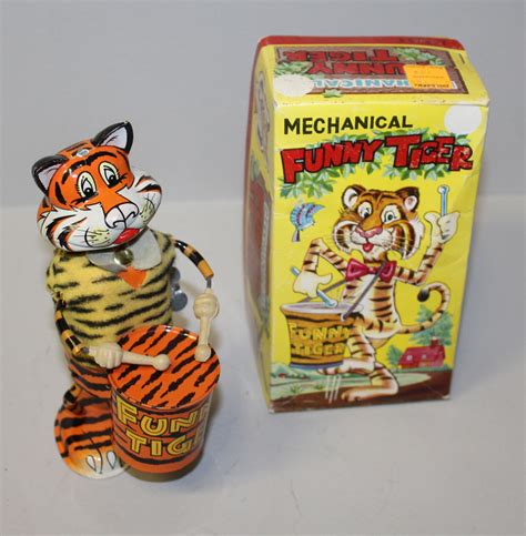 wind up metal tiger toy with fabric springtails|Amazon.com: Tin Windup Toys.